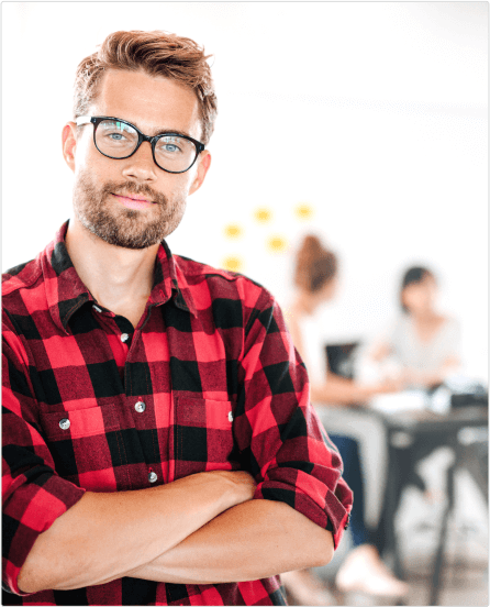 Man Wearing Glasses and Red Plaid Shirt Looking into Camera